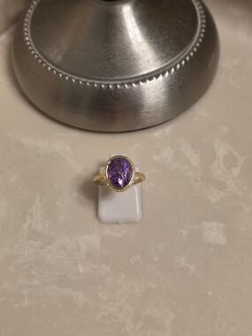 Gold Ring with Oval Purple Gemstone